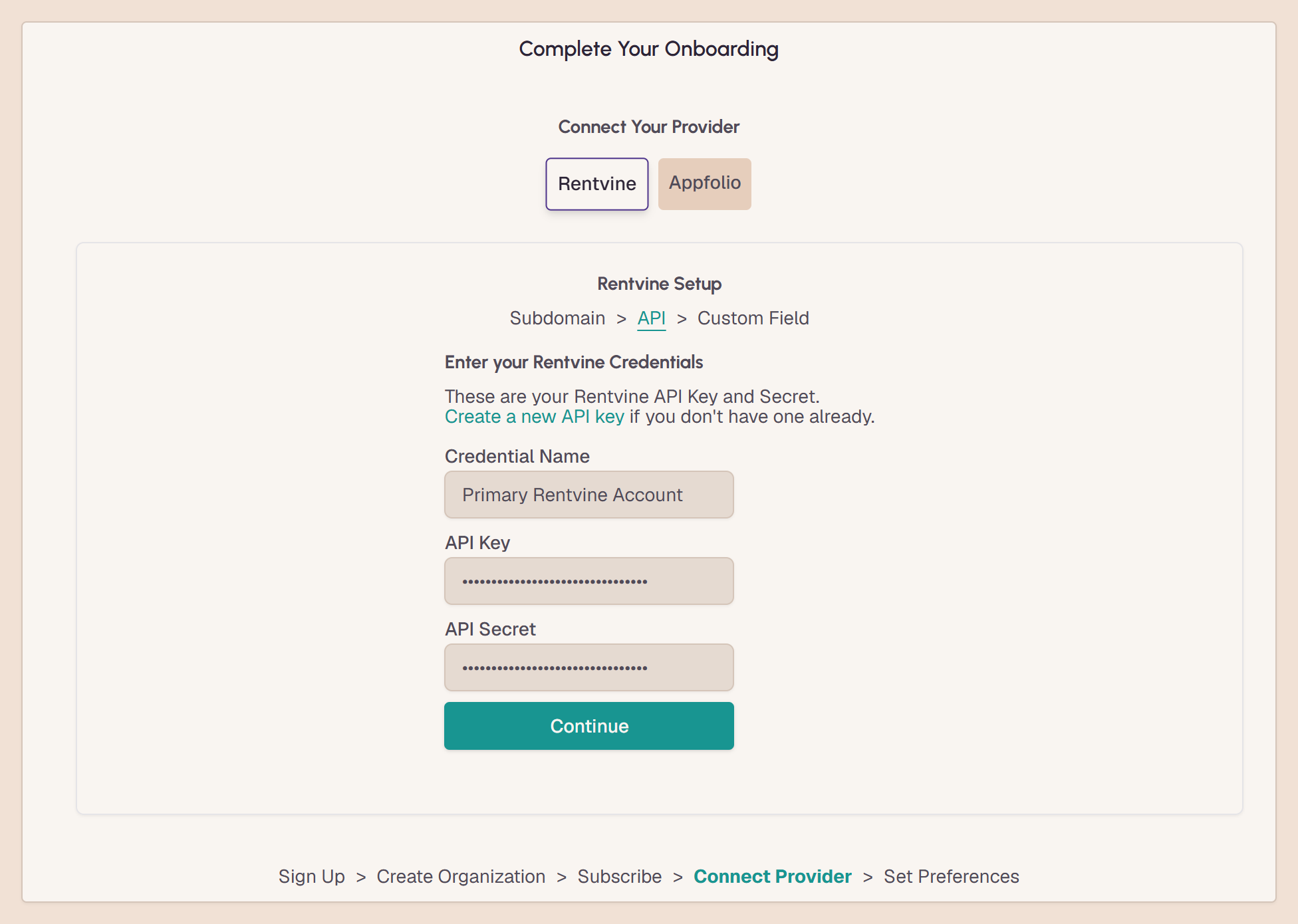 The VestaGlass onboarding step for connecting Rentvine: a credential name, an API key and an API secret, both masked, above a Continue button.